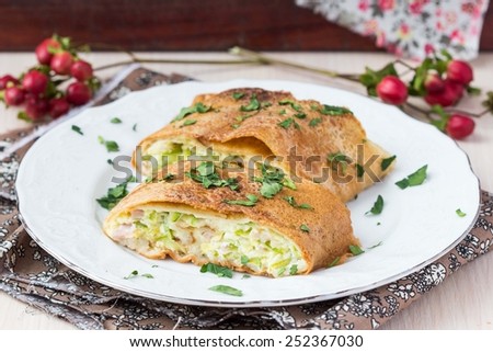Roll, strudel from pancakes, crepes with zucchini, ham, cheese, creamy taste, delicious breakfast