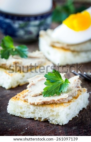 Rustic breakfast, boiled egg and toast with liver pate, tasty dish