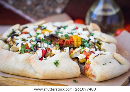 Vegetable pie with eggplant, zucchini, peppers, feta cheese, parsley, Greek dish