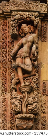 Bhubaneswar, India - Sculptures of female dancer on ancient Hindu temples made of sand stones in approximately 11th century.