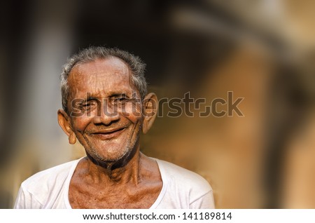 Old Indian Man portrait shot outside.