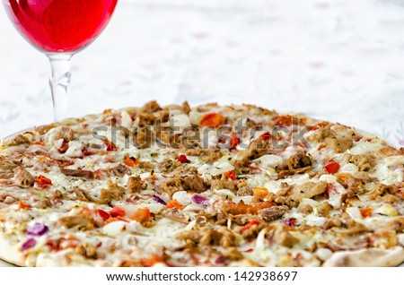 Tuna Fish Pizza with Red Wine (Shallow Depth of field- Focus on the middle part)