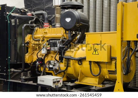 Close up diesel generator unit has a unit mounted radiator and fuel filter system.