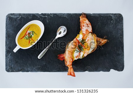 prawn with curry on the stone