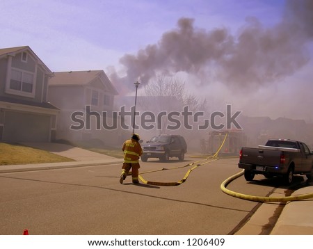 water being projected onto the roof of a house fire in Lafayette Colorado