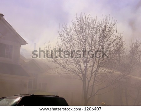 water being projected onto the roof of a house fire in Lafayette Colorado
