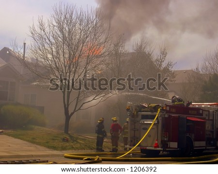 Fire truck and firemen at scene of house fire #35
