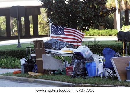 ORLANDO, FL - NOVEMBER 1:  Belongings of an Occupy Orlando group clutter the sidewalk in the camp across from the Orlando Chamber of Commerce on November 1, 2011, in Orlando, FL.
