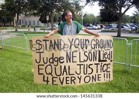 SANFORD, FL - JULY 9, 2013: A protester outside the Zimmerman murder trial at the Seminole County Criminal Justice Center in Sanford, Florida, on July 9, 2013.