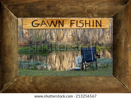 A rustic wood picture frame surrounds a photo of the author\'s favorite fishing hole and an engraved wood sign that reads, \