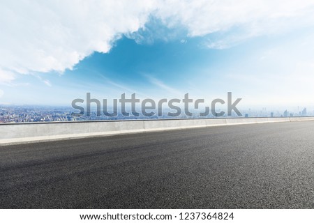 Panoramic city skyline and buildings with empty asphalt road