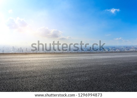 Empty asphalt road and modern city skyline with buildings in Shanghai,China