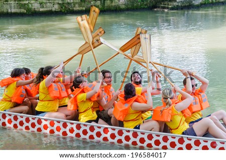 Hangzhou - June 2: the Dragon Boat Festival, xixi wetland held once a year of the dragon boat race, on June 2, 2014 in hangzhou, China.the players before the game to encourage each other.