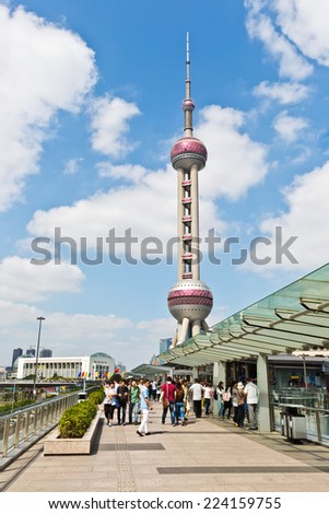 Shanghai - October 1: visitors before the Oriental pearl TV tower,  On October 1, 2014 in Shanghai, China. the Oriental pearl TV tower is a famous landmark in Shanghai.