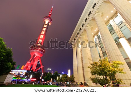 Shanghai - October 2: the Oriental pearl TV tower and the Roman column building scenery at night, on October 2, 2014 in Shanghai, China.Shanghai\'s night is very beautiful