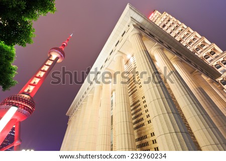Shanghai - October 2: the Oriental pearl TV tower and the Roman column building scenery at night, on October 2, 2014 in Shanghai, China.Shanghai\'s night is very beautiful