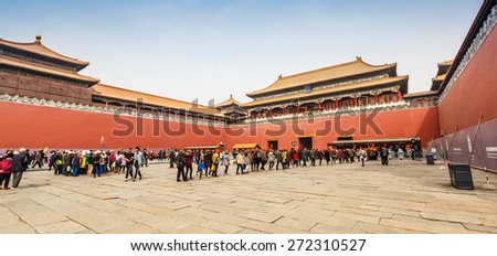 Beijing, China -  March 27, 2015: tourists are visiting Meridian gate in the Forbidden City. The Palace Museum was built in 1406-1420, served as imperial palace. UNESCO World Heritage.