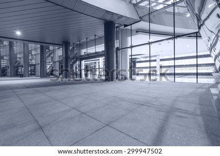 Empty walkway in front of the modern building