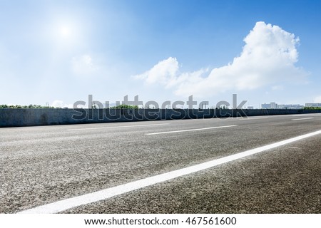 The new asphalt road under the blue sky