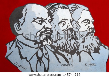 ORGOSOLO, SARDINIA, ITALY - JULY 26: Close-up about famous wall painting of Orgosolo in Sardinia, Italy on July 26, 2011. In this wall painting are represented Lenin, Engels and Marx.