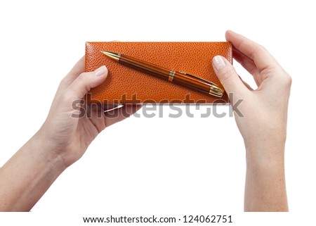 Ballpoint pen on brown box in his hands, isolated on white