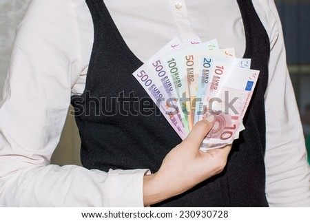 girl holding euro money in hands