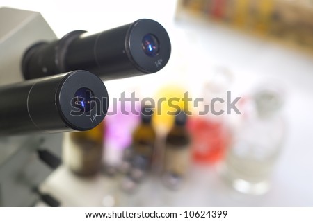 laboratory work place with microscope and test tubes