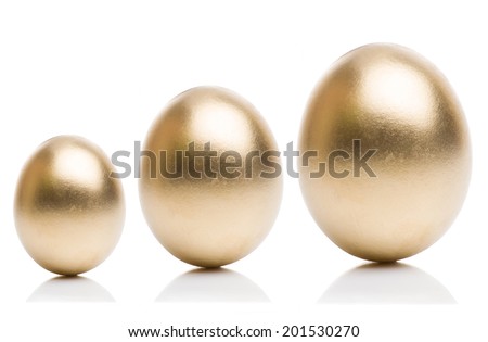 Golden eggs from small to large isolated on a white background. Concept of financial growth.