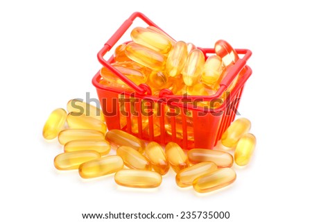 Cod liver oil Omega 3 gel capsules in the shopping basket, isolated on white background