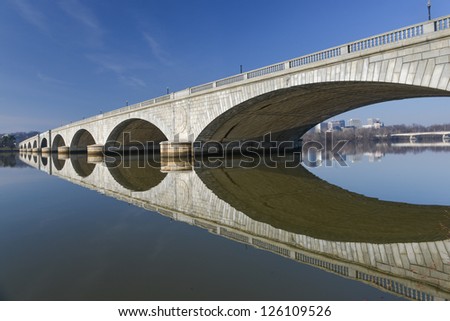 stock-photo-washington-dc-memorial-bridge-and-mirror-reflection-on-potomac-river-126109526.jpg