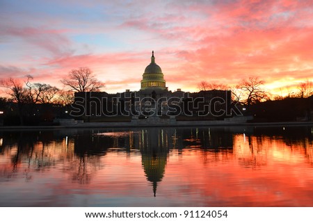 Capitol Building in a cloudy  sunrise with mirror reflection, Washington D.C. United States