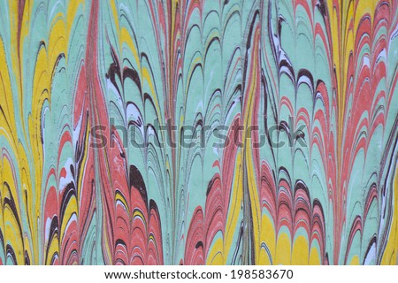 Traditional Turkish marbled paper artwork. Paper marbling is a method of water surface design, which can produce patterns similar to marble stone. Each pattern is unique due to nature of liquid