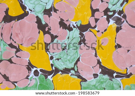 Traditional Turkish marbled paper artwork. Paper marbling is a method of water surface design, which can produce patterns similar to marble stone. Each pattern is unique due to nature of liquid