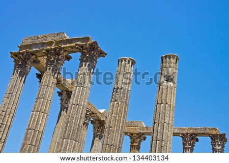 Ancient Roman building columns: columns of ancient Roman building (Temple of Diana) in ruins in Evora, Portugal, with Corinthian style capitals.