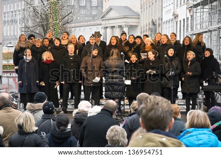 Copenhagen,Denmark - November 17, 2012: A Choir Sings Christmas Carols On A Square In The City Center, By-Standers Gathered In Front Of The Stage