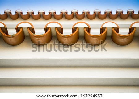 frontal close-up shot of the eaves (ending of rooftop) of a traditional villa in Portugal