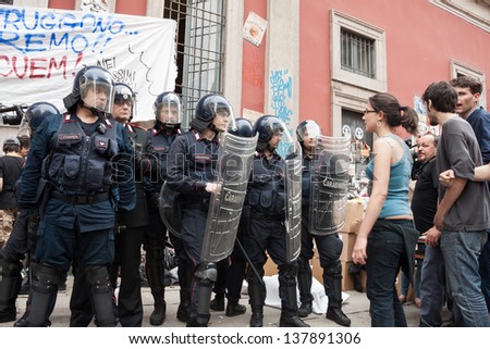 MILAN, ITALY - MAY 7: University students during a protest march in Milan MAY 7, 2013. University students march in the streets to protest against  the evacuation of their occupied bookstore by police