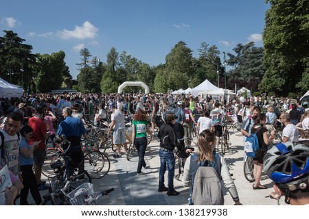 MILAN, ITALY - MAY 12: Cyclopride meeting in Milan MAY 12, 2013. Thousands of people pedal together through the town to launch their ecological message for a more sustainable mobility