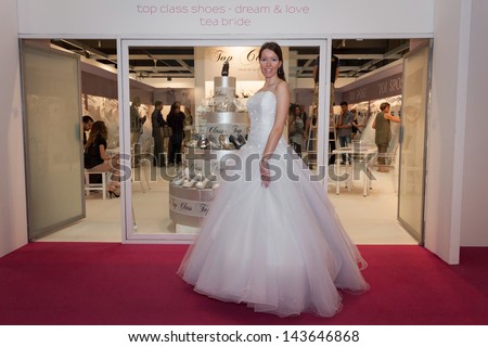 MILAN, ITALY - JUNE 21:  A model with wedding dress poses at SposaItalia, international exhibition of bridal and formal wear according to Italian style, on JUNE 21, 2013 in Milan