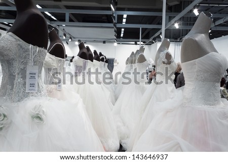 MILAN, ITALY - JUNE 21: Beautiful wedding dresses on mannequins at SposaItalia, international exhibition of bridal and formal wear according to Italian style, on JUNE 21, 2013 in Milan