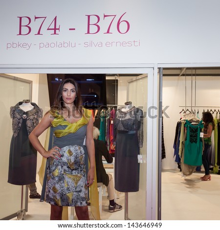 MILAN, ITALY - JUNE 21:  A model with elegant formal dress poses at SposaItalia, international exhibition of bridal and formal wear according to Italian style, on JUNE 21, 2013 in Milan