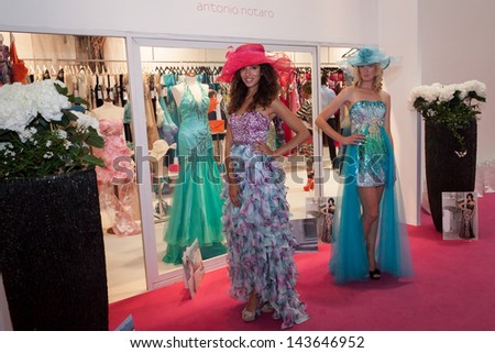MILAN, ITALY - JUNE 21:  Models with elegant formal dresses pose at SposaItalia, international exhibition of bridal and formal wear according to Italian style, on JUNE 21, 2013 in Milan