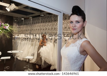 MILAN, ITALY - JUNE 21:  A model with wedding dress poses at SposaItalia, international exhibition of bridal and formal wear according to Italian style, on JUNE 21, 2013 in Milan