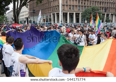 MILAN, ITALY - JUNE 29: People at gay pride parade in Milan JUNE 29, 2013. Thousands of people march in the city streets for the annual gay pride parade, claiming equality and legal rights.