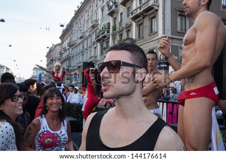 MILAN, ITALY - JUNE 29: People at gay pride parade in Milan JUNE 29, 2013. Thousands of people march in the city streets for the annual gay pride parade, claiming equality and legal rights.