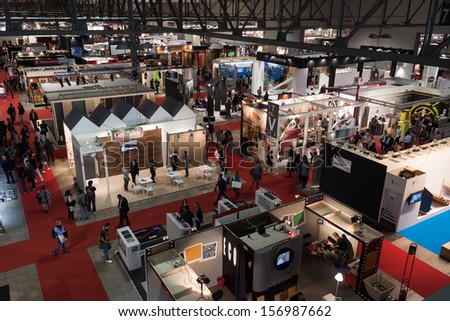 MILAN, ITALY - OCTOBER 3: Top view of booths and people at Made expo, international architecture and building trade show on OCTOBER 3, 2013 in Milan.