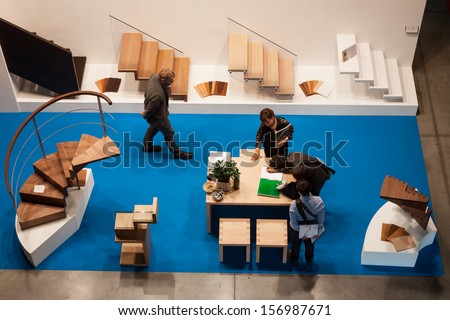 MILAN, ITALY - OCTOBER 3: Top view of a stand with people at Made expo, international architecture and building trade show on OCTOBER 3, 2013 in Milan.