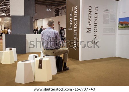 MILAN, ITALY - OCTOBER 3: A man takes some rest at Made expo, international architecture and building trade show on OCTOBER 3, 2013 in Milan.