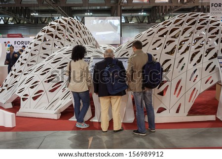 MILAN, ITALY - OCTOBER 3: People visit Made expo, international architecture and building trade show on OCTOBER 3, 2013 in Milan.