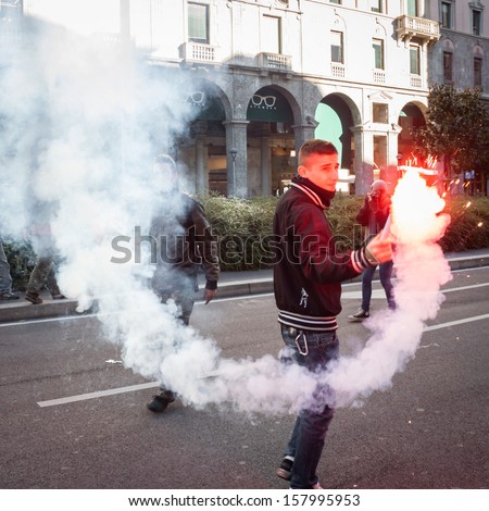 MILAN, ITALY - OCTOBER 11: Secondary school students march in the city streets to protest against money cuts in the public school on OCTOBER 11, 2013 in Milan.